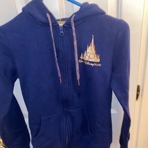 Disney sweater xs worn 3 times with a mini oil stain